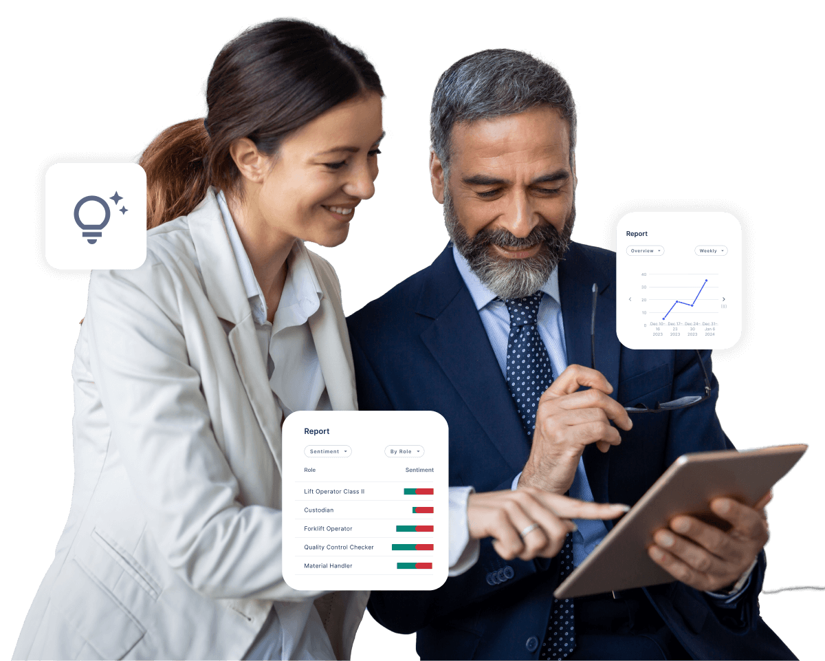 two co-workers reviewing data on a tablet